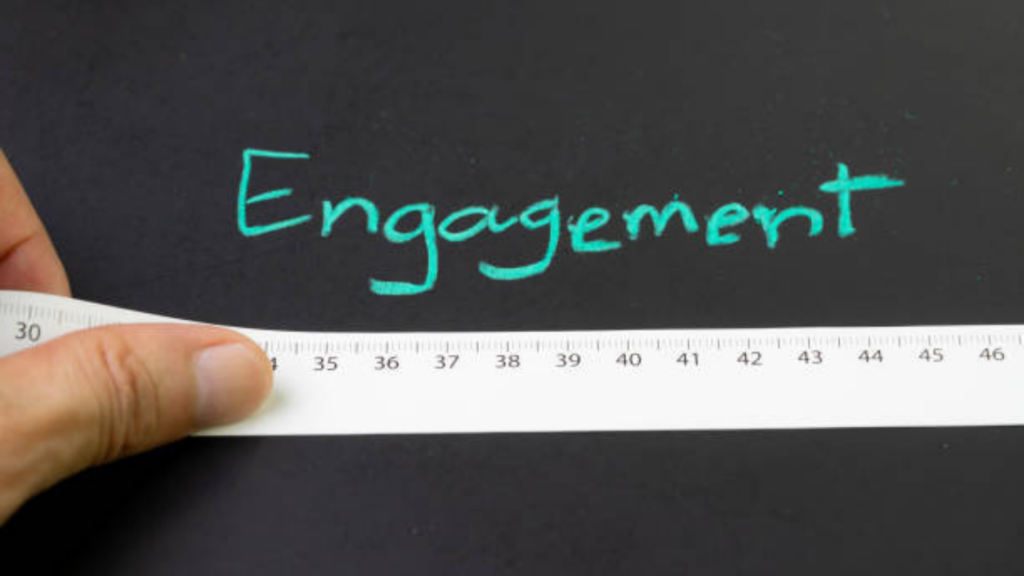Using a ruler to measure the length of the word "engagement"